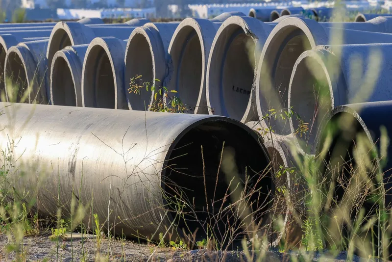 Sewer line repair — excavated sewer pipe being replaced