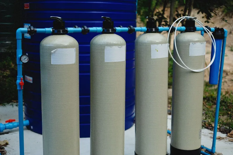 Water filtration — whole-home water filtration system on a utility wall