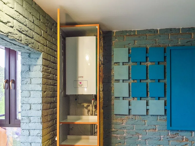 Water heater repair — a wall-mounted tankless water heater unit